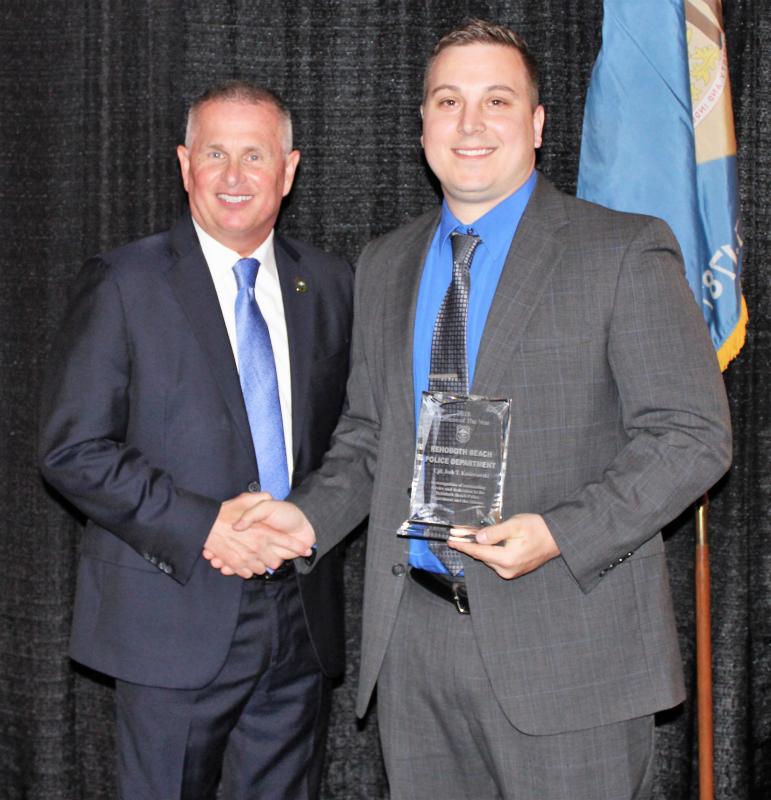Rehoboth Beach Police Chief Keith Banks, left, presents the 2018 Officer of the Year Award to Cpl. Josh Kosiorowski.